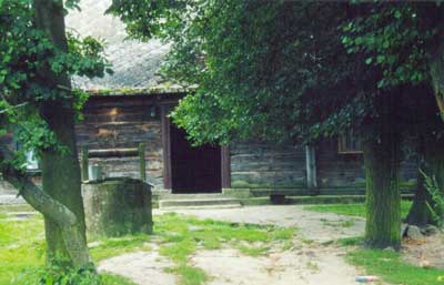 Wooden house with well